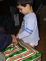 Vincent opening his present.