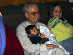 Great Grandpa holding Alek.