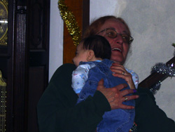 Great Aunt Jeanie holds Kenji.