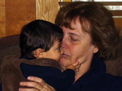 Alek grabs Great Aunt Chris for a kiss.