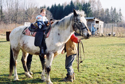 Kenji riding Apache the horse.