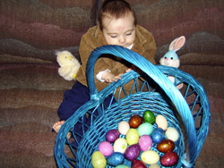 Kenji plays with his Easter basket.