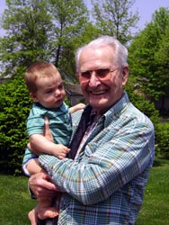 Great grandpa holds Kenji.