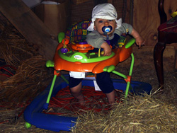 Kenji plays in the hay.