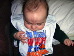 Kenji examines his bib.