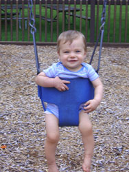 Kenji in a bucket swing.