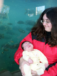 Kenji and Brandy in front of the hippo tank.